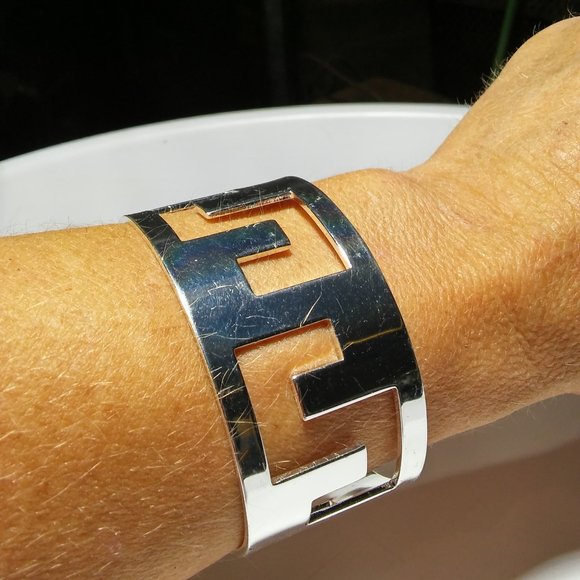 Jewelry - Women`s silver tone cut out cuff bracelet. 2 1/2